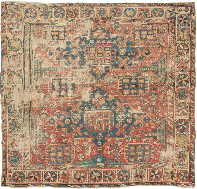 This Shirvan rug features a classic soumak medallions in blue on a patinated brick field containing shape filled octagons, rosettes and various other protection symbols. Framed by a main border of sharply petalled rosettes that is flanked by minor borders of interlocking 'z's. </span>Classic soumak patterning rendered in pile weave is very rare.