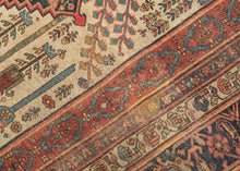 This grand scale antique Bidjar carpet features the evocative Bid Majnun design a poetic and symbolic layout named for the weeping branches of the trees and reminiscent of the legendary figure Majnun in Persian literature. The rare ivory ground provides a luminous backdrop for a striking garden composition, filled with stylized willows, cypresses, and flowering shrubs rendered in rich natural dyes.