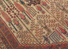 This grand scale antique Bidjar carpet features the evocative Bid Majnun design a poetic and symbolic layout named for the weeping branches of the trees and reminiscent of the legendary figure Majnun in Persian literature. The rare ivory ground provides a luminous backdrop for a striking garden composition, filled with stylized willows, cypresses, and flowering shrubs rendered in rich natural dyes.