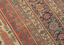 This grand scale antique Bidjar carpet features the evocative Bid Majnun design a poetic and symbolic layout named for the weeping branches of the trees and reminiscent of the legendary figure Majnun in Persian literature. The rare ivory ground provides a luminous backdrop for a striking garden composition, filled with stylized willows, cypresses, and flowering shrubs rendered in rich natural dyes.