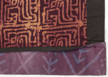 This batik patchwork was crafted in Indonesia during the 20th century.
Batik is a wax-resist technique that creates a distinctive style. This textile features a variety of batik designs that have been patchworked together into four quadrants creating a dynamic design in purples and yellows. 
