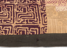 This batik patchwork was crafted in Indonesia during the 20th century.
Batik is a wax-resist technique that creates a distinctive style. This textile features a variety of batik designs that have been patchworked together into four quadrants creating a dynamic design in purples and yellows. 