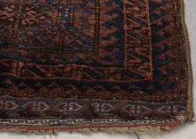 Afghan Baluch lattice design in blue, dusty pink and mauve pink. Plush silky wool with a very dark but lustrous complexion. Framed by an alternating "S" with contrasting sawtooth borders and finished with multiple bands of detailed weft float kilim. Originally intended to be used as a bag, remnants of the goat hair enclosures still survive.