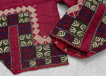 These trouser cuffs were handmade in Turkmenistan during the 20th Century.   Turkmen women traditionally wear colorful ankle length dresses with baggy trousers in contrasting color and decorated bands. These trousers feature wonderful detailed embroidery bands near the ankles in blue, red, green and ivory on a magenta cloth.