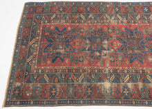 This Shirvan rug was woven in the Caucasus during the late 19th century.
It features three powerful leshgi stars on an earthy red ground full of various rosettes and protection symbols.  Encapsulated by multiple individualized borders including rosettes, sunbursts, and calyx and serrated leaves. A very handsome palette of blues, reds, greens and aubergine is accentuated by glowing coral and orange among other tones.