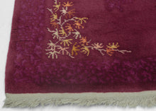 This Art Deco rug was handwoven in Tientsin, China during the second quarter of the 20th century. 
This Deco rug is quite calm and elegant.  An asymmetric inner border of branches and leaf like shapes in autumnal shades provide substance and balance to the delicate tone on tone patterning found in the the field and around the perimeter.