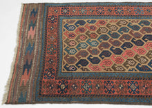 The field design is composed of alternating rows of botehs that aligned on the diagonal on a camel ground. The botehs are big and plump in contrasting tones of purples, blues and pinks including an early synthetic hot pink that isn't for Baluch purists but adds some visual interest for the rest of us!  Finished on both ends with original interlocking lightning bolt kilims.