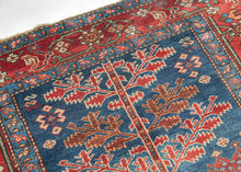 This unusual Karaja rug features a Tree of Life composition rendered in a vivid palette of indigo, madder, ivory, and soft terracotta tones. It combines the technical precision and geometric boldness typical of Karaja weavings with a spiritually resonant format more commonly associated with urban workshop rugs.