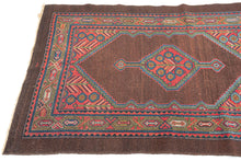 Antique Serab
It features a rosette filled central medallion filled on an open chocolate ground and flanked by floral spray cornices in vibrant rose, sky blue, fern green and ivory.  Nicely framed by a chocolate brown perimeter which strikes the perfect balance with the open field and further highlights the use of the uncommon tone.