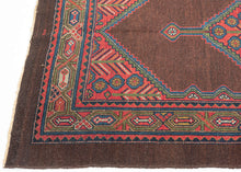 Antique Serab
It features a rosette filled central medallion filled on an open chocolate ground and flanked by floral spray cornices in vibrant rose, sky blue, fern green and ivory.  Nicely framed by a chocolate brown perimeter which strikes the perfect balance with the open field and further highlights the use of the uncommon tone.