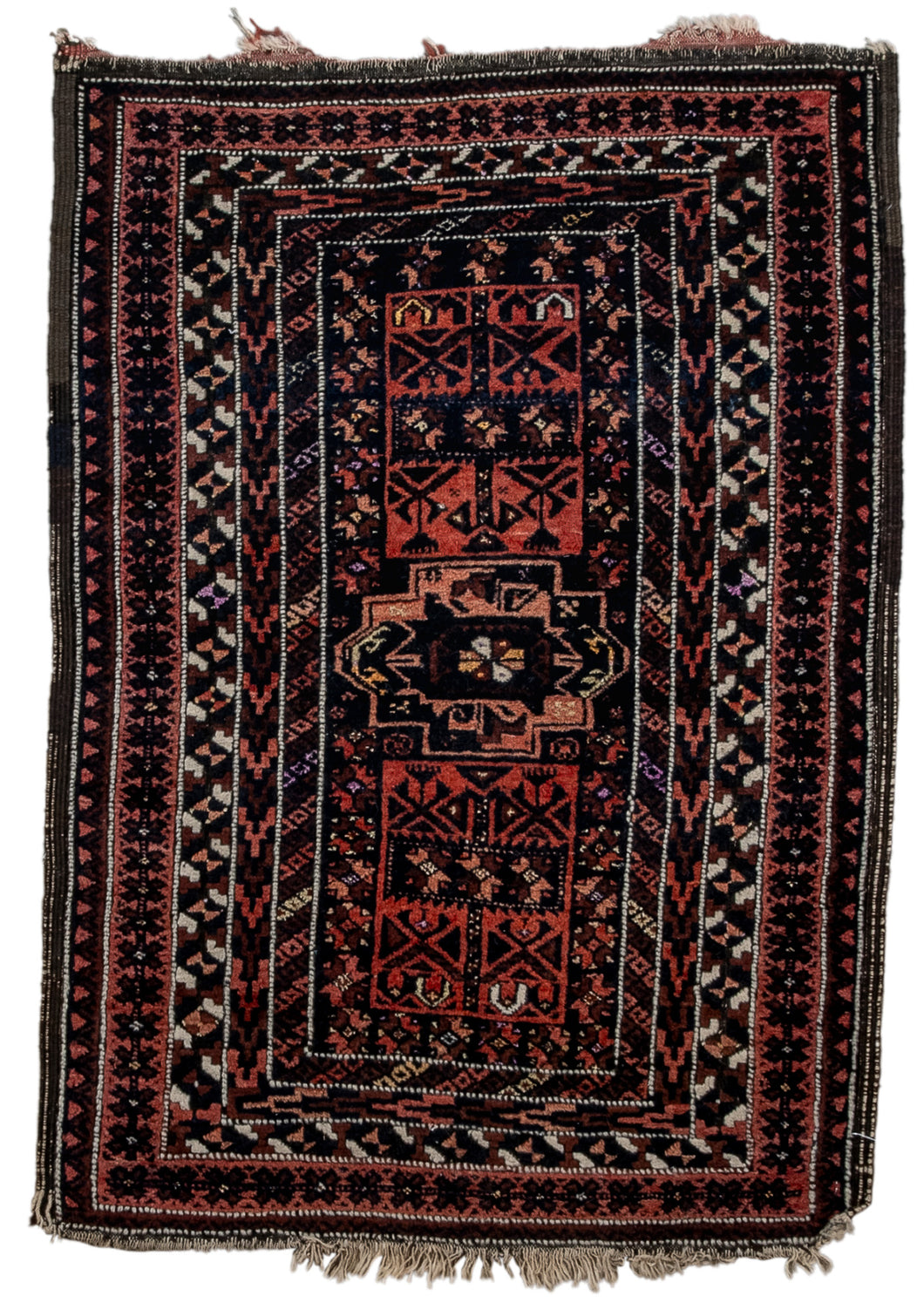 It features a central turkmen-esque medallion flanked by two rectangular cartouches filled with vegetal forms. Framed by a variety of narrow borders in different simple abstracted forms that build layers and dimensionality. A wide palette for baluch standards with deep burgundy, soft reds, peach, ivory and brown. Small pops of yellow and purple rendered in silk are a welcome addition. AFGHAN BALUCH