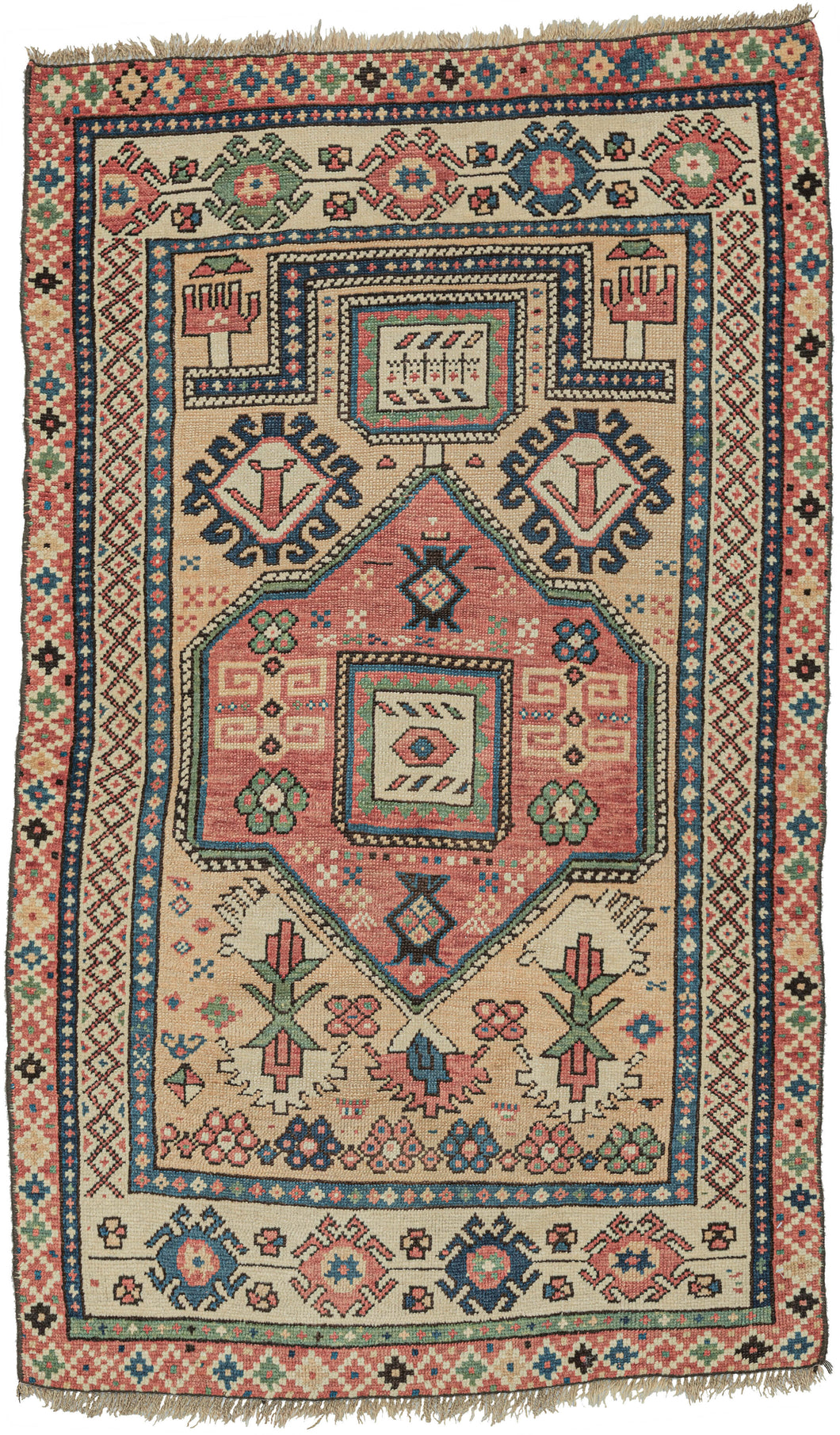 Classical prayer rug format hybridized with other Caucasian elements and weaving style.