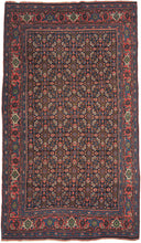 This Bidjar was handwoven during the second quarter of the 20th century.
It features an all-over herati patterned field in blues, reds, coral, ivory and green on a midnight blue backdrop. This bidjar lives up to its reputation as the "Iron Rug" with dense tightly packed construction which makes for a heavy and hard-wearing rug. A watermelon main border lightens the composition.