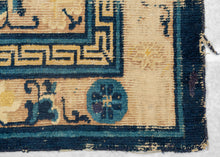 Ningxia Rug circa 1800 composed of a central mandala flanked by four smaller medallions over an intricate diamond lattice repeat. With a classic Ningxia palette that includes two shades of blue, brown, ivory, mauve and a desirable imperial yellow ground. The main border design features floral motifs on a mauve ground. The inner minor borders features a Greek key motif and the outer perimeter border features bands of both blue tones.