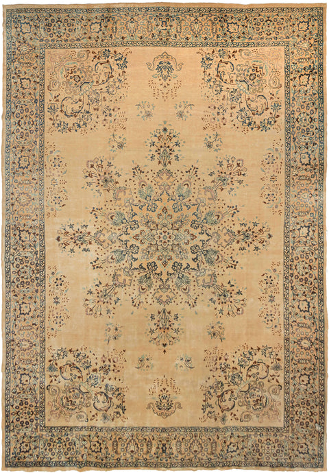 This Meshed was woven during the second quarter of the 20th century.  It features an ornate floral firework of a central medallion and with four overflowing vase cornices and various small floral sprays on an expansive sandy ground. The pattern is rendered in a soft palette of indigo, seafoam, lilac, hickory and ivory. Framed by an intricate border of palmettes on the same soft sand ground. Elegant yet unpretentious.
