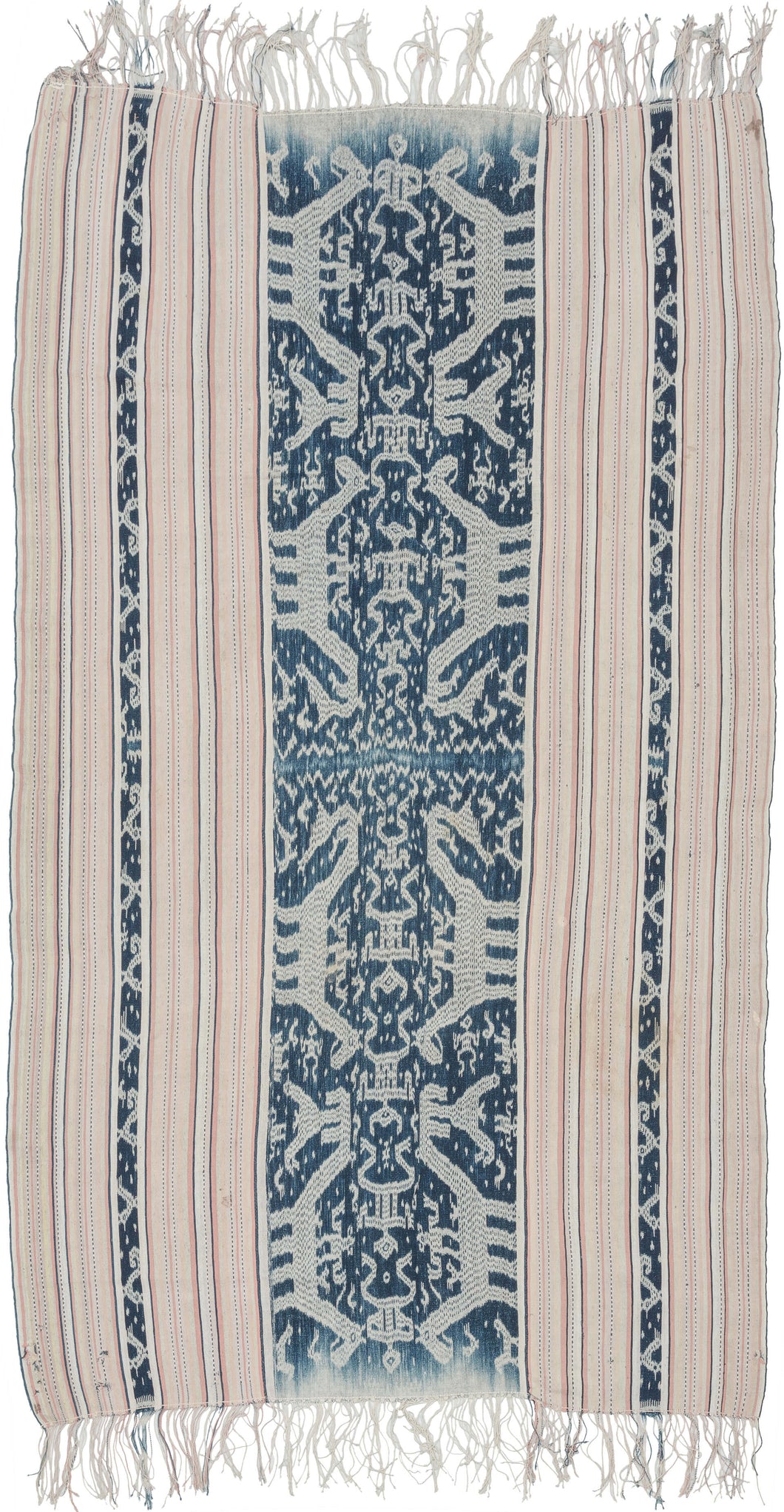 This ikat was handmade on the island of Sumba in Indonesia during the middle of the 20th century.  Ikat is a warp resist dyeing technique similar to