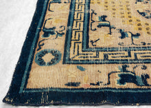 Ningxia Rug circa 1800 composed of a central mandala flanked by four smaller medallions over an intricate diamond lattice repeat. With a classic Ningxia palette that includes two shades of blue, brown, ivory, mauve and a desirable imperial yellow ground. The main border design features floral motifs on a mauve ground. The inner minor borders features a Greek key motif and the outer perimeter border features bands of both blue tones.