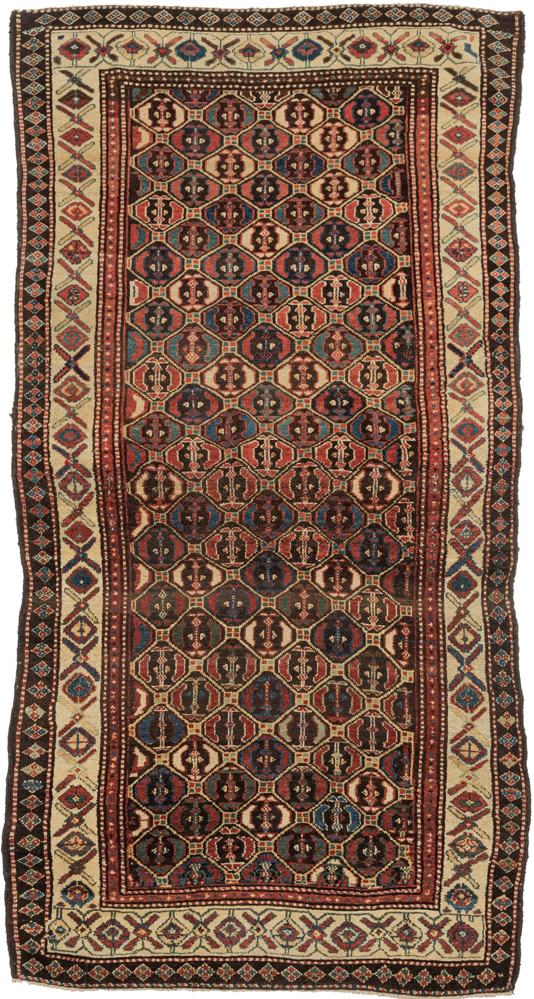 This Lori rug was handwoven during the late 19th century.   It features a lovely diamond lattice design which both well executed but also with the right amount of wonkiness to give it some personality. Rendered in lush wool an a vibrant red, blue, yellow and green with brown and ivory accents. The main border of
