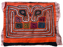 Vintage Mola cloth handmade by the Guna (previously spelled Kuna) people of the San Blas Islands.  Mola is a reverse appliqué technique, similar to the technique used in quilting but using multiple layers of different-colored cloth that are first sewn together before a design is created by cutting away different layers. These cloths are traditionally made in pairs to be worn on the front and back of women's blouses.  This Mola features a psychedelic pattern of confronting bird heads.
