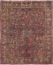 This rug features a curvilinear floral design on a red wine field. The floral work is intricate and an excellent example of the type of floral sprays Sarouk rugs are famed for. The main border features a palmette and blossom design on a navy ground. This classically patterned rug is perfect for high traffic areas and should last for generations to come. 