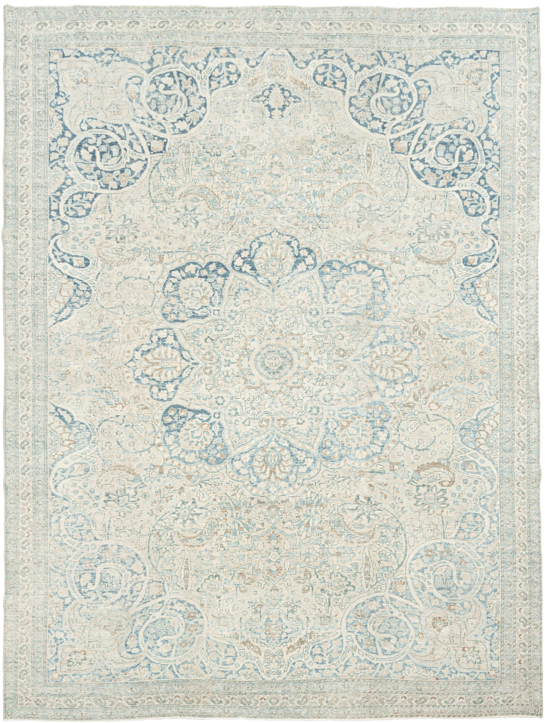 It features an elegant central medallion surrounded by flowing arabesques and floral tracery in delicate shades of sky blue, ivory, and soft taupe. The pale, airy palette and finely drawn design lend the piece a refined, almost ethereal quality that makes it versatile for both traditional and contemporary interiors. Framed by a scrolling vine border, this rug is a study in subtle sophistication and is a timeless decorative element for any space.