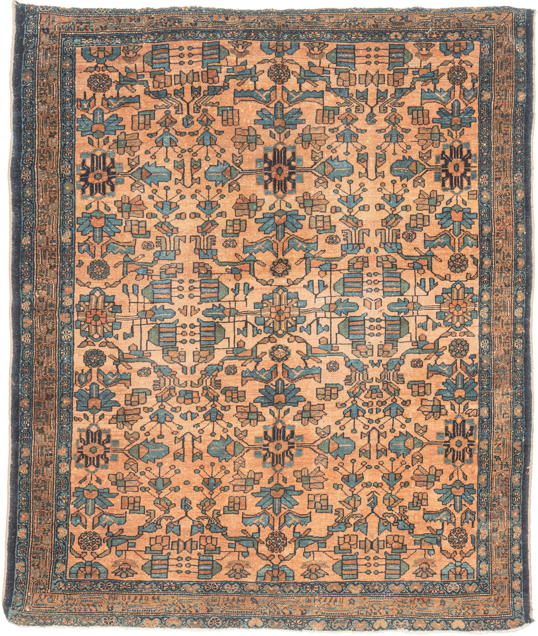 This Lilihan rug was handwoven by Armenians during the second quarter of the 20th century. 
It utilizes graphic floral patterning with an Art Deco feel. Rendered in lively blues, greens, and red with brown and gold on a coral ground. A central focal point blends seamlessly into the repeat field pattern. Framed by a meandering border on a red clay ground.