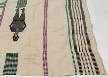 This blanket was likely woven in Nigeria during the middle of the 20th century.
It was woven in multiple stripes which have been attached horizontally. It features four human figures and six goats as well as various stripes in green, purple and black against an ivory ground. A wonderful and less common palette most often seen on Nigerian weavings. The figuresd and stripes have been completed using weft substition over the ivory strips.