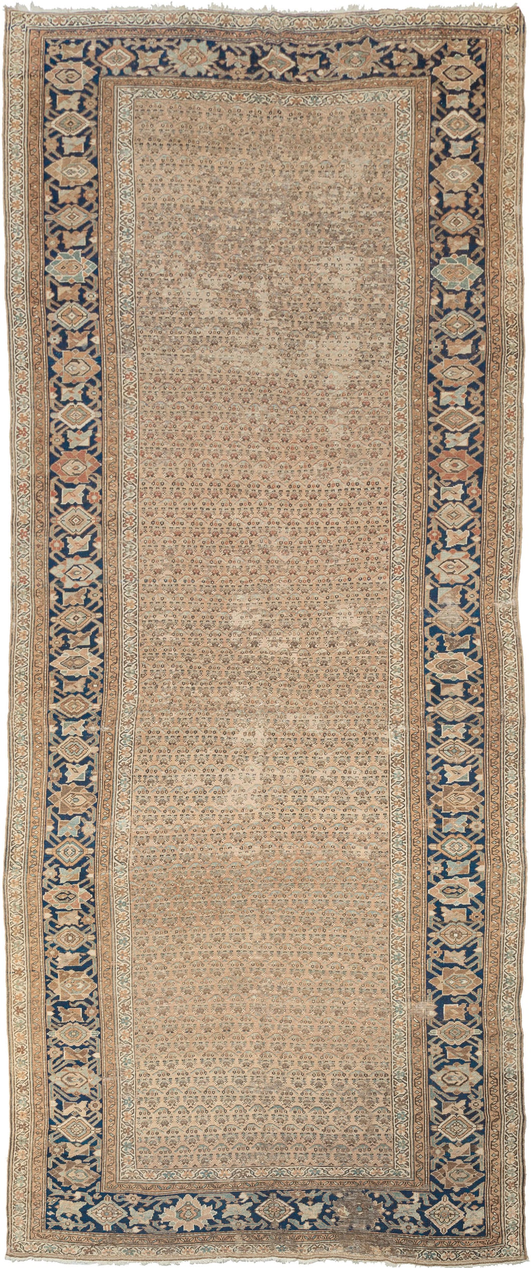This Malayer runner was handwoven during the second quarter of 20th century.
This washed out wide runner features a repeat pattern abstracted botehs that blend right into one another on the soft and calming camel ground. Framed by a crisp border of palmettes in caramel, soft blues, earthy reds and burnt orange on a deep navy ground.
