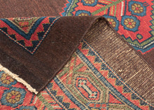 Antique Serab
It features a rosette filled central medallion filled on an open chocolate ground and flanked by floral spray cornices in vibrant rose, sky blue, fern green and ivory.  Nicely framed by a chocolate brown perimeter which strikes the perfect balance with the open field and further highlights the use of the uncommon tone.