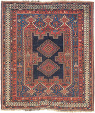 It features classic patterning associated with the Afshar people of Sirjan. In the center are two latch-hooked medallions on deep navy surrounded by a lacquer-red ground surrounded by a final field of cobalt.  Various greens, turqoise, apricot and aubergine contrast wonderfully and accentuate the various Small symbols and figures that fill the negative space. Nicely framed by an ivory main border which brightens the composition.