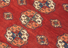 This Tekke main rug was handwoven during the first quarter of the 20th century in Turkmenistan.
The field features a grid rounded main guls in apricot, indigo, turquoise and ivory on vibrant red ground. The space between the grid is filled with rows of cruciform shaped secondary guls. In a rare square format that allows for very luxurious and open spacing of the guls.