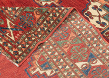 This Tekke main rug was handwoven during the first quarter of the 20th century in Turkmenistan.
The field features a grid rounded main guls in apricot, indigo, turquoise and ivory on vibrant red ground. The space between the grid is filled with rows of cruciform shaped secondary guls. In a rare square format that allows for very luxurious and open spacing of the guls.