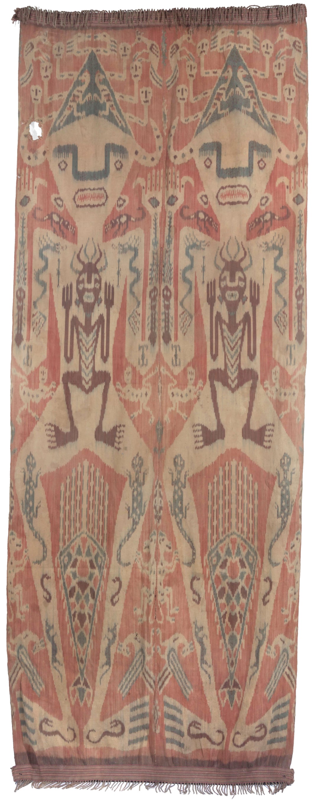 Antique Indonesian Ikat textile constructed in two panels, each with the same motif. Each design features one large person with another person inside among other symbols including lizards, horses and dragons. Atop the head is a hat of skulls with surrounding birds. The hands feature marks similar to stigmata and a crocodile sits atop each shoulder. Prominent near the legs is a large lobster and smaller monkeys.