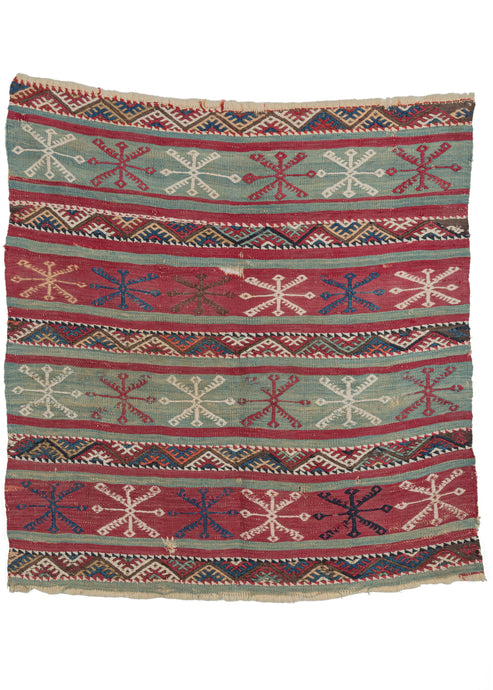 Antique Turkish Kilim that features a flatwoven ground of horizontal turquoise and raspberry bands segmented by brocaded strips of colorful interlocking triangles. The widest bands feature large embroidered snowflake motifs.