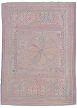 Bengali Kantha featuring an off-center mandala with reciprocal panels on top and bottom. The central mandala is squished to one side by three elephants and one horse form. The top and bottom panels both feature a row of plant forms that blossom into birds. Soft red, blue, and yellow on a soft pink ground.