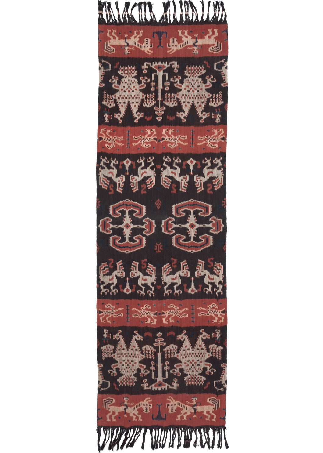 The design of this East Sumbanese Hinggi Kombu ikat textile is a mirror image of itself, which can be read in both directions and from side to side. The central geometric motif is named habak, a common centre motif for ikats, and was once a symbol of royalty. The other figures are animals like horses and cockatoos, both commonly found animals in Sumbanese weaving.