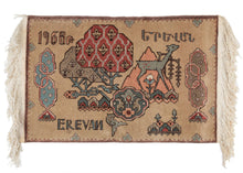 Mid Century Armenian handwoven small rug dated "1968", with the Armenian capital "Erevan" woven in both English and Armenian. Crafted as a curio for visitors to the country. In addition to showcasing the renowned woven art of Armenia, it also includes abstracted local flora and fauna in nreds, greens, blues and browns and has a soviet design feel.