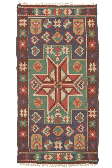 This Antique Swedish Agedyna features a central red eight-pointed star in a green polygon which perfectly connects to two purple blocks on the top and bottom. Throughout the composition, there are various depictions of women and birds. These weavings are called 