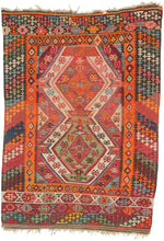 This kilim was handwoven in the Konya–Karapınar region of Central Anatolian during the late 19th century.

A radiant piece with an explosive palette and a beautifully articulated double-medallion composition. The weaver layers crimson, apricot, madder rose, turquoise, soft greens, and ivory into a shimmering, prismatic field. These hues create a depth and warmth that are unmistakably Anatolian.