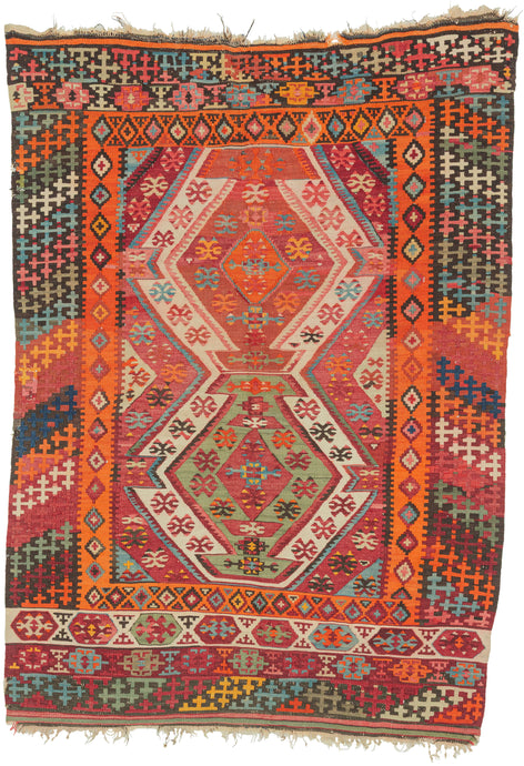 This kilim was handwoven in the Konya–Karapınar region of Central Anatolian during the late 19th century.

A radiant piece with an explosive palette and a beautifully articulated double-medallion composition. The weaver layers crimson, apricot, madder rose, turquoise, soft greens, and ivory into a shimmering, prismatic field. These hues create a depth and warmth that are unmistakably Anatolian.