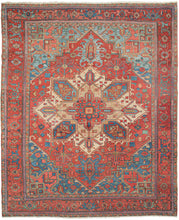 19th century Heriz Serapi large rug featuring the classic Heriz layout with a graphic geometric central medallion. The rich lacquer red in the field and the border contrast perfectly with the brilliant blue which shifts from cobalt to an icy blue like tropical waters shifting in depth. The central medallion showcases both blue as well both ivory and soft camel adding depth and nuance to the traditionally heavier focal point to mesmerizing effect.
