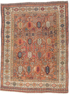 This exceptional late 19th-century Shekarlu rug is a superb example of the bold, highly expressive weaving tradition of the Qashqai Confederacy. Its rich terracotta field is animated by an elegant arrangement of towering cypress and tree-of-life motifs, interspersed with a lively assortment of tribal devices, rosettes, birds, combs, and other protective talismanic symbols that reward close inspection.