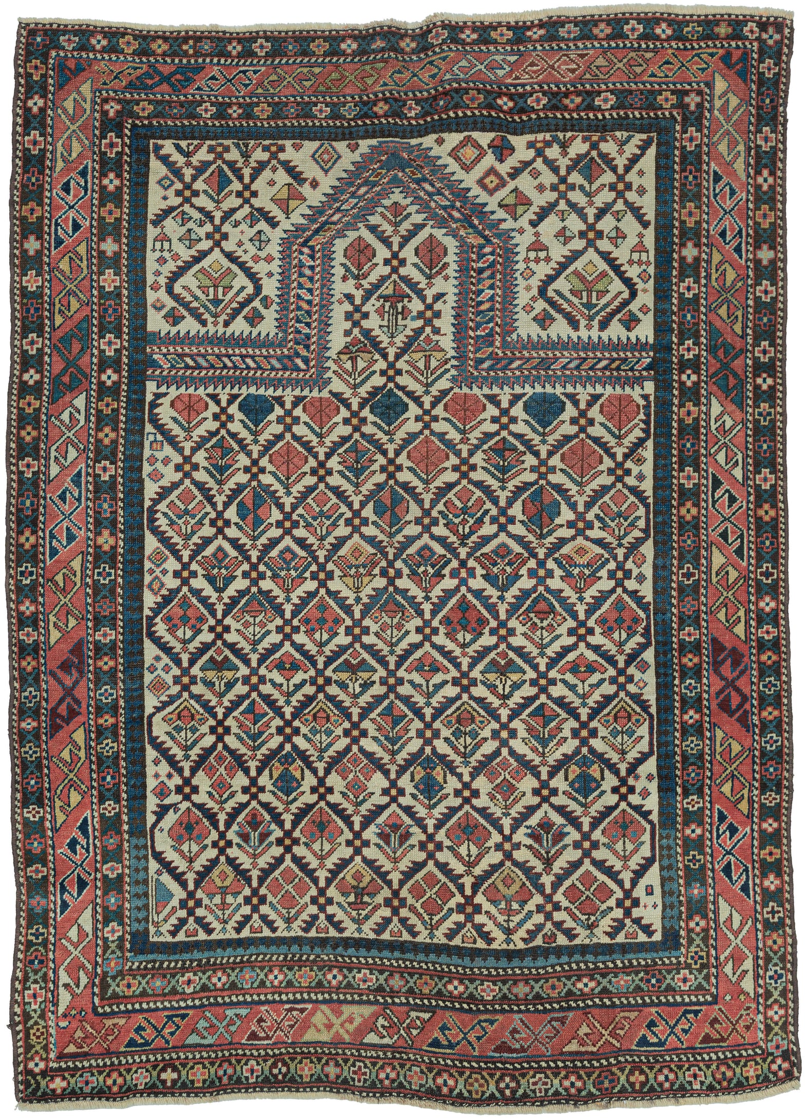 This finely woven late 19th-century Shirvan prayer rug exemplifies the sophisticated graphic language of the eastern Caucasus. Woven on a luminous ivory ground, the field is filled with an elegant lattice of stylized flowering plants and geometric blossoms, creating a rhythmic all-over pattern that is both highly ordered and remarkably lively.