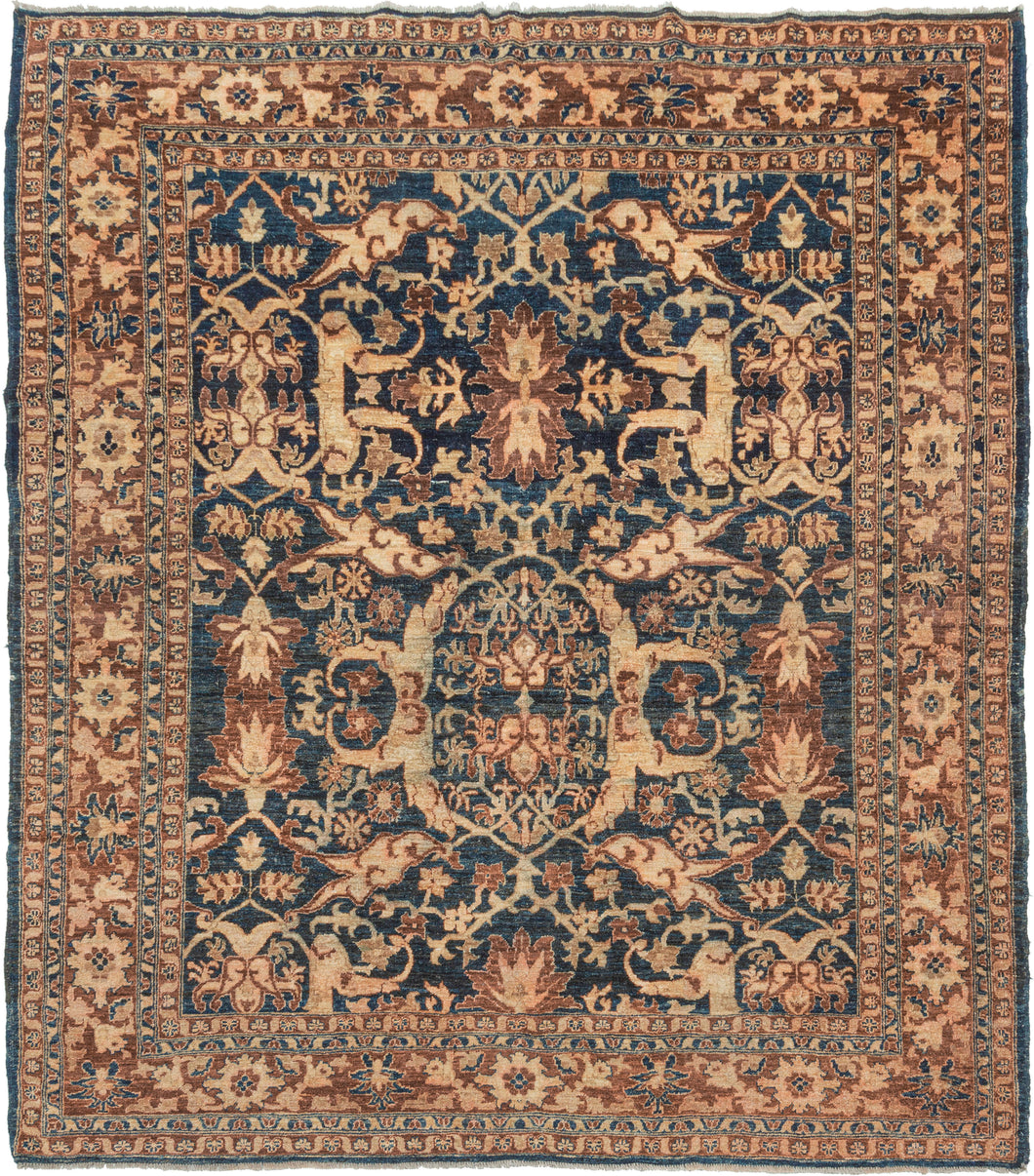 This Contemporary Afghan Mahal eatures an all-over design of curling arabesques and energetic rosettes in creamy khaki and reddish rust dancing on a deep navy ground. The pattern is more commonly associated with mahal rugs of western Iran. The rug has uneven coloring in places but flows with the design.