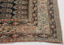 This Tabriz rug was handwoven during the early 20th century.

It features an all-over design of penguin-like&nbsp;botehs&nbsp;waddling row by row in alternating directions. The botehs shift slightly in proportion and placement giving the composition a wavy feel. Adding to the funky feel and nature of the rug the weaving style begins to change near the top from a crisper weave to a looser one while the colors used slowly begin to shift as the new weaver presumably began to run out of the original yarn.&nbsp;