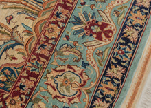 Hereke It features a directional tree of life motif with a central flowering vase. The ivory mihrab mihrab is formed by two deep navy top cornices each supported by a pillar. The whole is framed by a birght turqoise border of alternating palmettes. The silk pile accentuates exquisite tones of reds, pinks, oranges, greens, yellows and three distinct and exceptional blue tones. Very finely woven of dense high quality silk