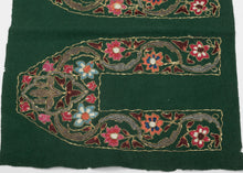 This vibrant green wool panel is richly adorned with colorful chain-stitch embroidery and was originally intended as the upper portions of traditional Kashmiri slippers (jooti or khussa). The bold floral motifs—rendered in vivid coral, blue, crimson, and ivory silk threads are enclosed within sweeping arabesques and stylized lotus forms, all outlined with gleaming metallic thread.