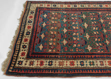 This rug was woven in the South Caucasus in or around the Karabagh region and is dated as 1281 Hijri or 1864 in the Gregorian calendar.&nbsp;

It features a rare and poetic allover design of stylized floral shrubs ngrowing from pots and evoking themes of paradise gardens. The uncommon and desirable rich green ground shifts in tone from hunter green to forest green and finally a sublime sapphire blue. The overall rhythm is visually arresting—layered yet orderly, with fine asymmetrical details that animate th