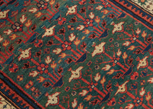 This rug was woven in the South Caucasus in or around the Karabagh region and is dated as 1281 Hijri or 1864 in the Gregorian calendar.&nbsp;

It features a rare and poetic allover design of stylized floral shrubs ngrowing from pots and evoking themes of paradise gardens. The uncommon and desirable rich green ground shifts in tone from hunter green to forest green and finally a sublime sapphire blue. The overall rhythm is visually arresting—layered yet orderly, with fine asymmetrical details that animate th