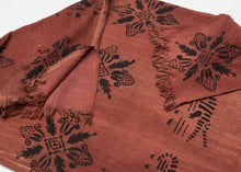 This tunic was woven and block-printed In Mali or Burkina Faso during mid–20th century

A striking vintage West African tunic created from handwoven cotton strips and decorated with bold block-printed motifs. The central design features rows of stylized crocodiles, powerful symbols associated with water spirits, protection, and ancestral strength throughout the Sahel. Alternating with them are vertical millet stalk motifs, representing nourishment, fertility, and the continuity of community life.